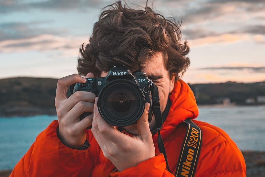 Me, man taking photo using Nikon D200, camera, red coat, holding