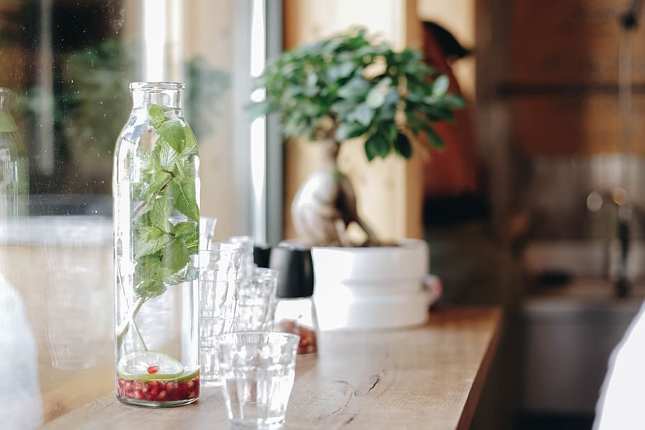 clear shot glasses on top of brown wooden table, trees, green HD wallpaper