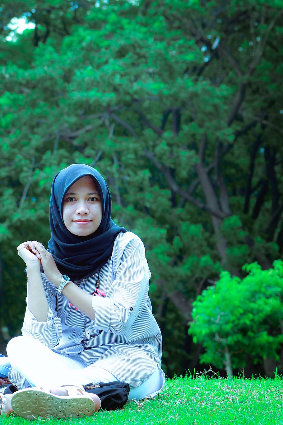 woman wearing black hijab headscarf sitting on green grass during daytime, HD wallpaper
