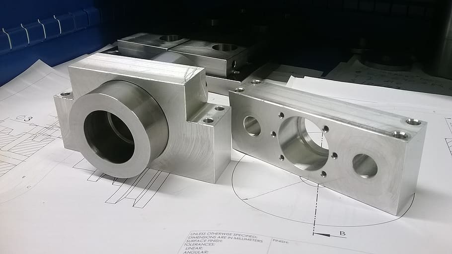 rectangular gray metal tool on white printing paper, steel, machinery