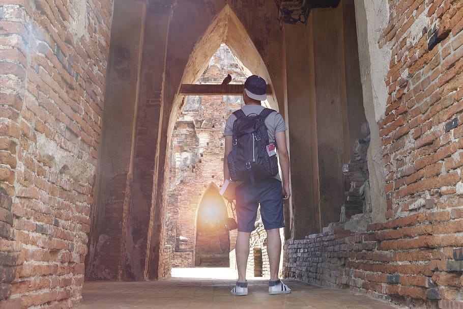 man, person, bricks, architecture, adventure, back view, backpack HD wallpaper