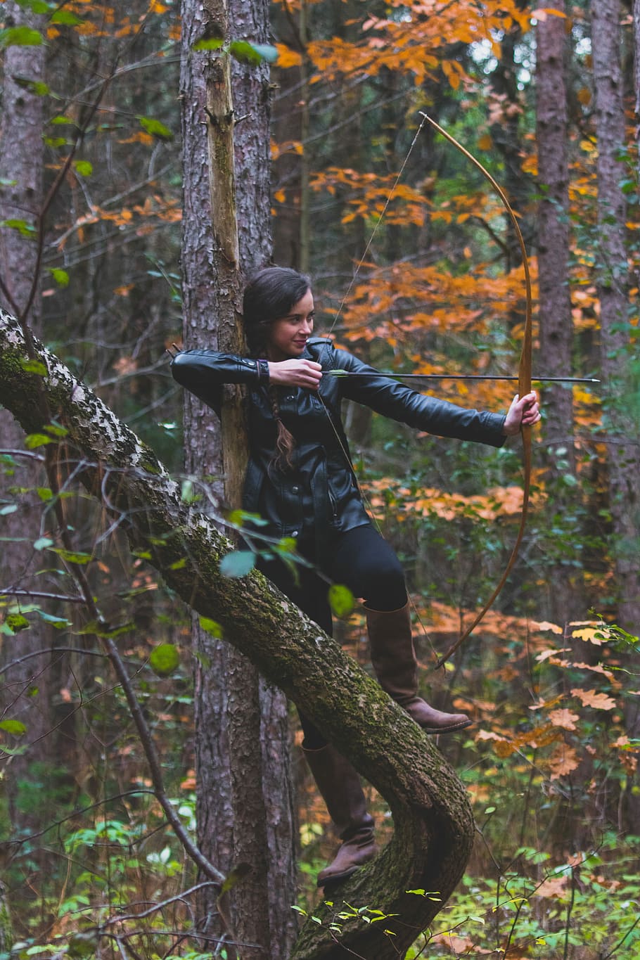 woman in black jacket holding longbow, woman holding composite bow on forest HD wallpaper