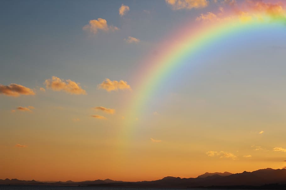 rainbow at golden hour, sunset, cloud, sky, silhouette, mountain