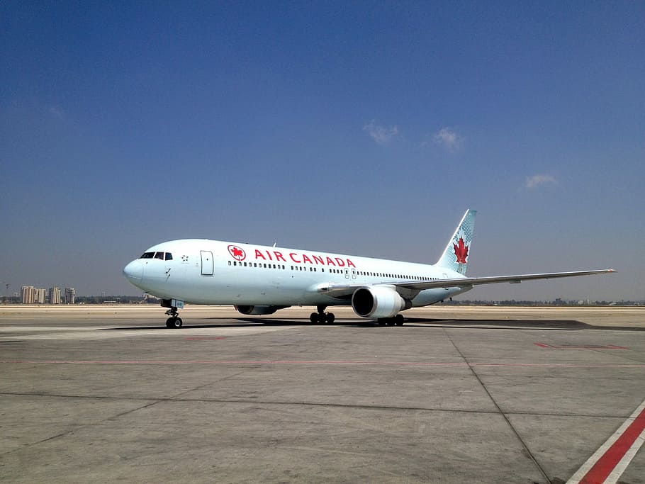 red Air Canada airliner under blue sky, Air Port, Israel, Bgn