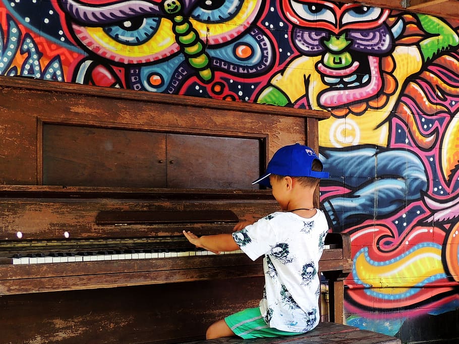boy using piano, child, playing, happy, sitting, entertainment HD wallpaper