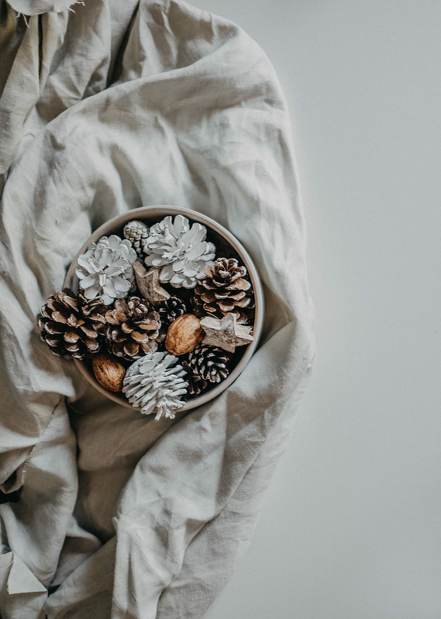 Christmas pot pourri, white and brown pine cones with container HD wallpaper