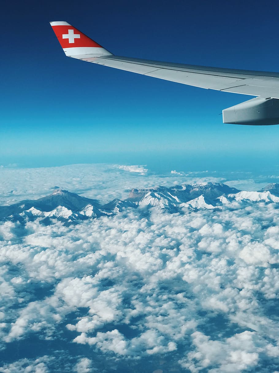 Flying  from Switzerland, gray airplane wing above white clouds, HD wallpaper