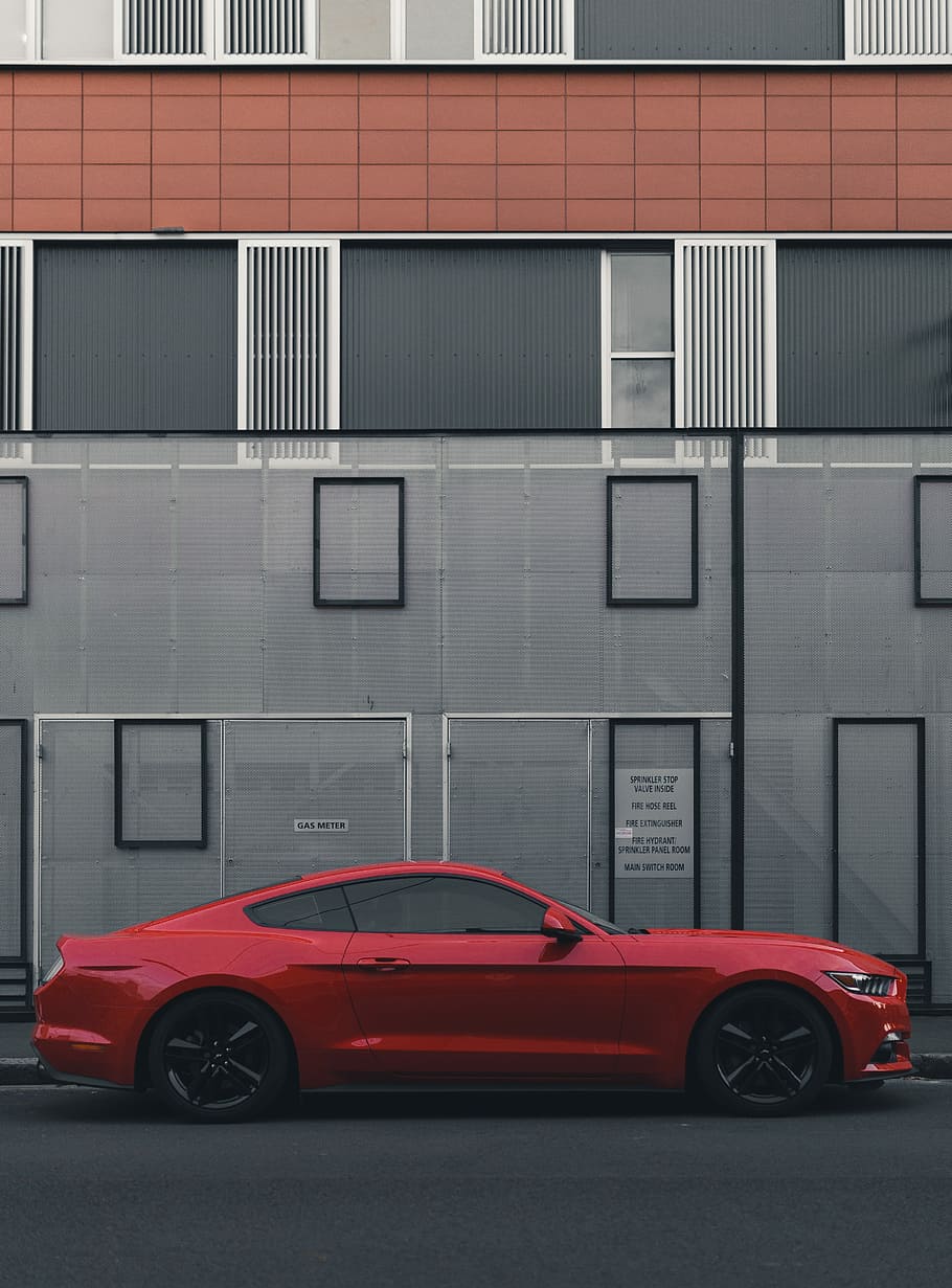red Ford Mustang coupe parked beside the building, photo of red coupe HD wallpaper