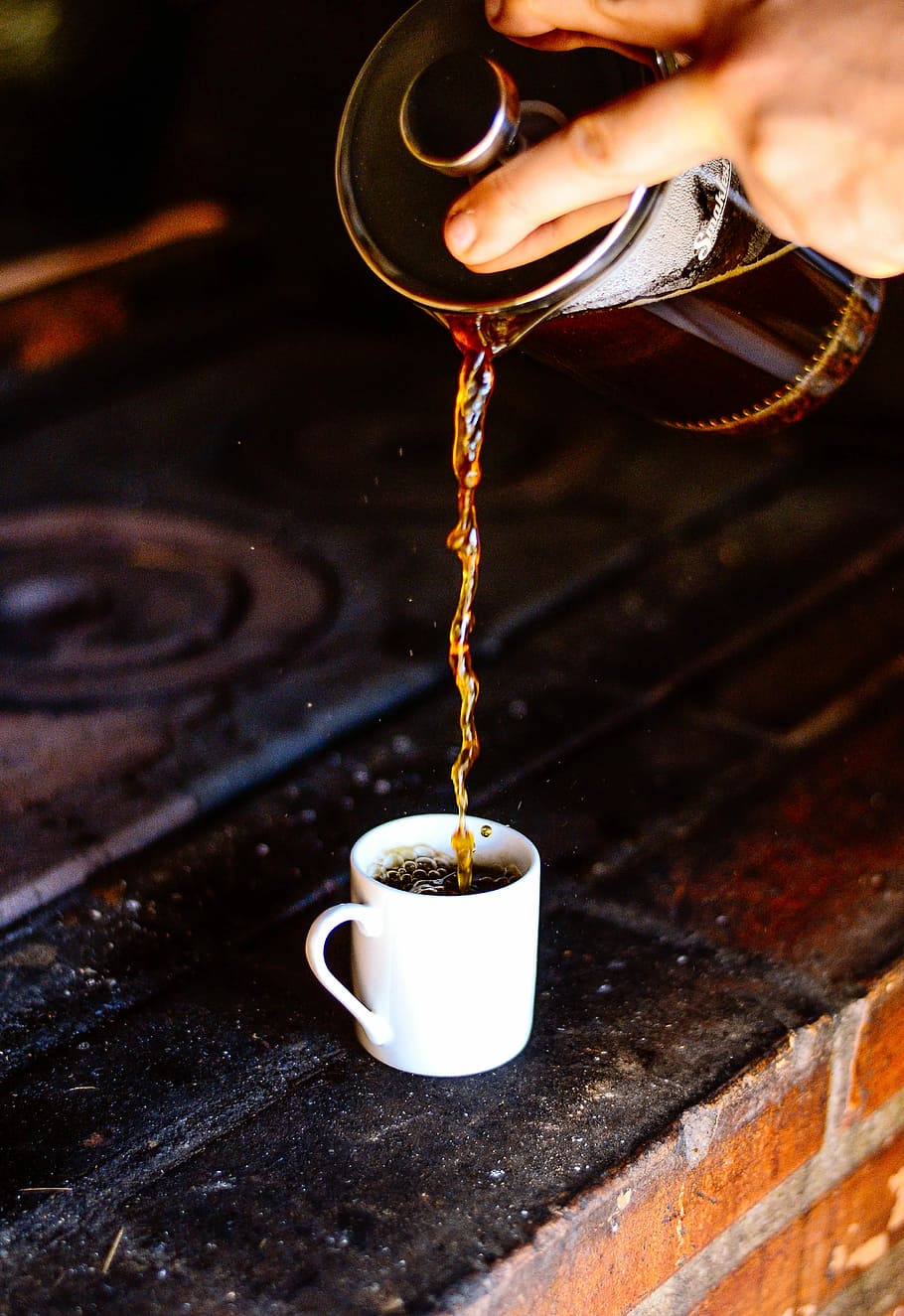 person pouring coffee on white ceramic teacup, person pouring coffee in white ceramic mug HD wallpaper
