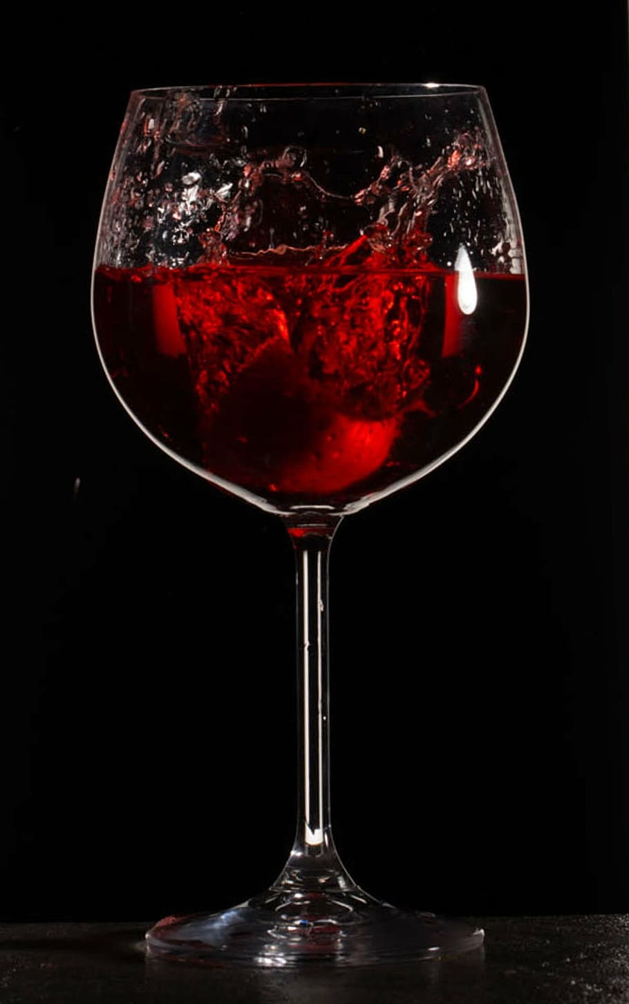 clear long-stem wine glass with red liquid, splash, drink, wineglass