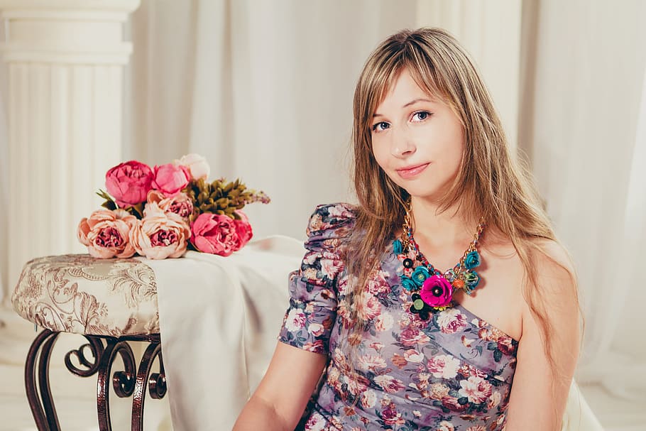 woman sitting near curtain, portrait, studio, flowers, light background HD wallpaper