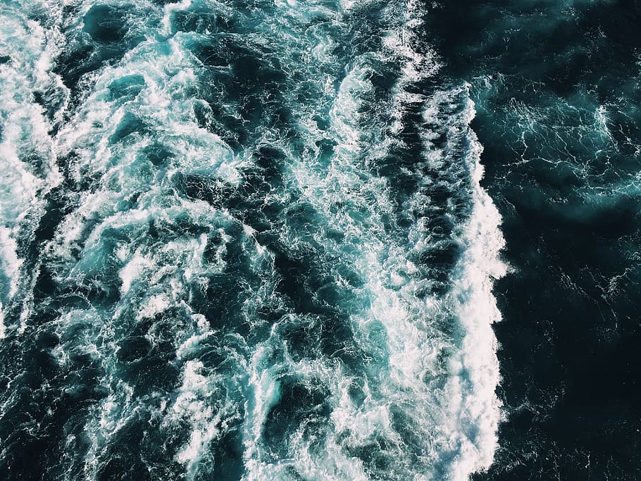 high angle photo of sea waves, water, churning, turquoise, dark