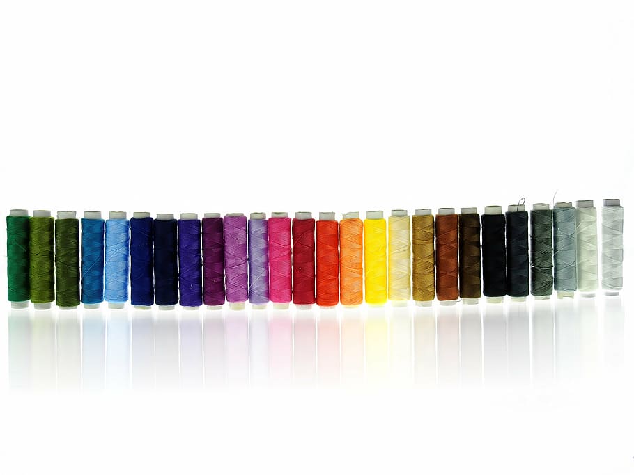 assorted-color thread spool lot on white suface, yarn, sew HD wallpaper
