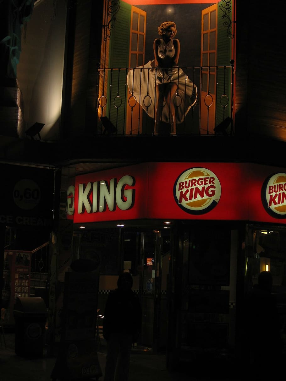 person standing at the front of Burger King store, fast food