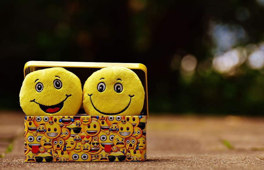 two emoji toys inside yellow box, smilies, funny, joy, emoticon, HD wallpaper