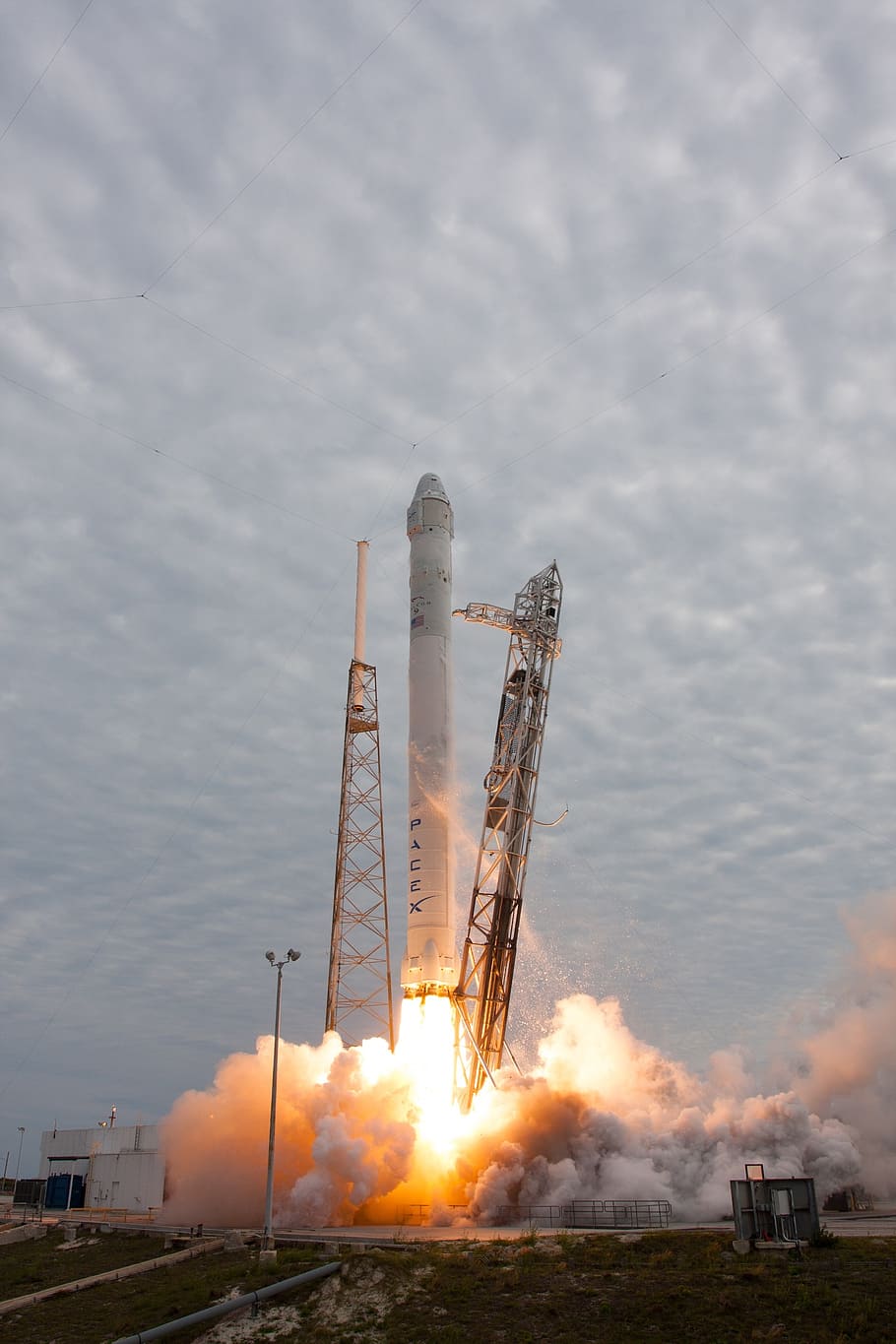 launched white rocket, rocket launch, spacex, lift-off, flames