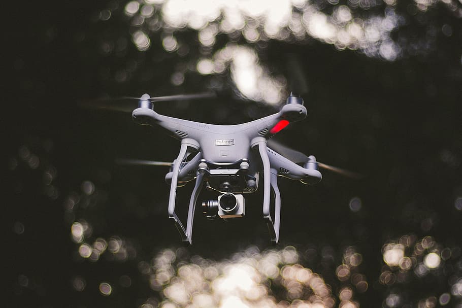 white DJI quadcopter flying selective focus photography, selective focus photography of flying white quadcopter, HD wallpaper