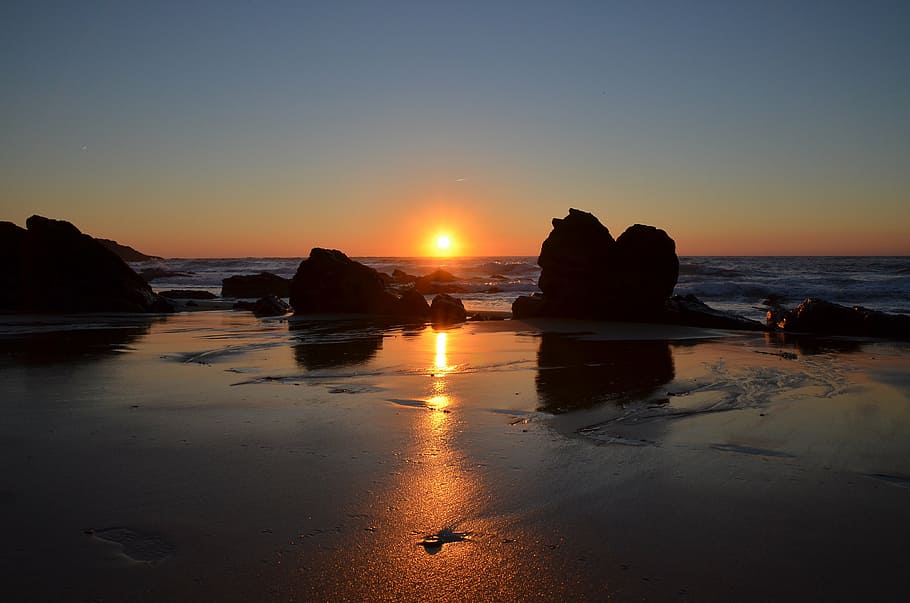silhouette of monoliths on seashotre, sunset, rocks, nature HD wallpaper