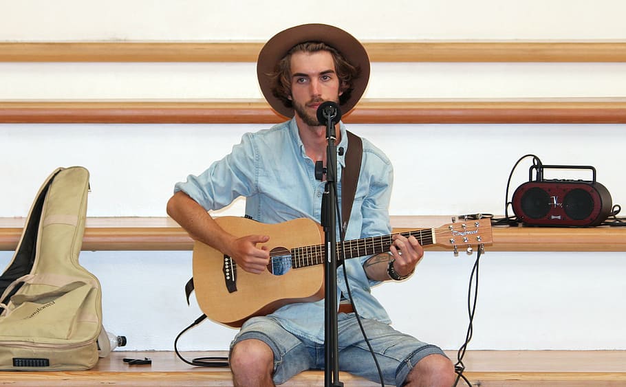 man playing brown guitar, singer, music, artists, show, musician