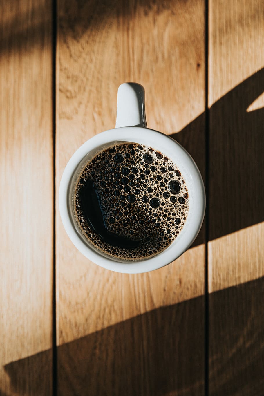 white ceramic mug on brown wooden surface, white ceramic coffee mug filled with coffee HD wallpaper