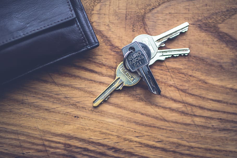 silver keys on brown wooden surface, lock, wallet, top, wood - material HD wallpaper