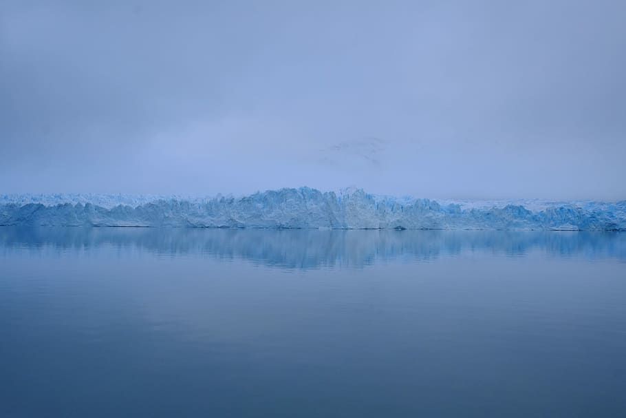 photography of sea near mountain covered with snow, iceberg near body of water HD wallpaper
