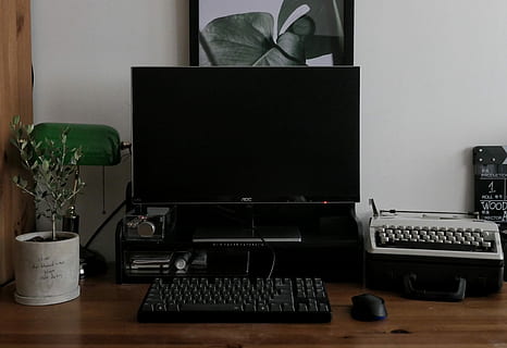 working desk, computer desktop set on desk, typewriter, personal computer HD wallpaper