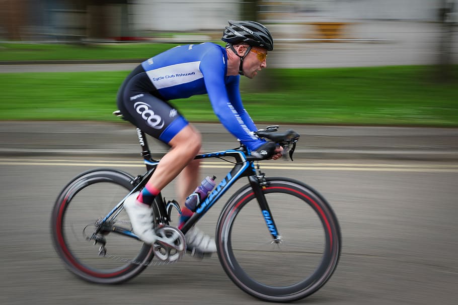 timelapse photography of man riding bicycle, time lapse photo of cyclist HD wallpaper
