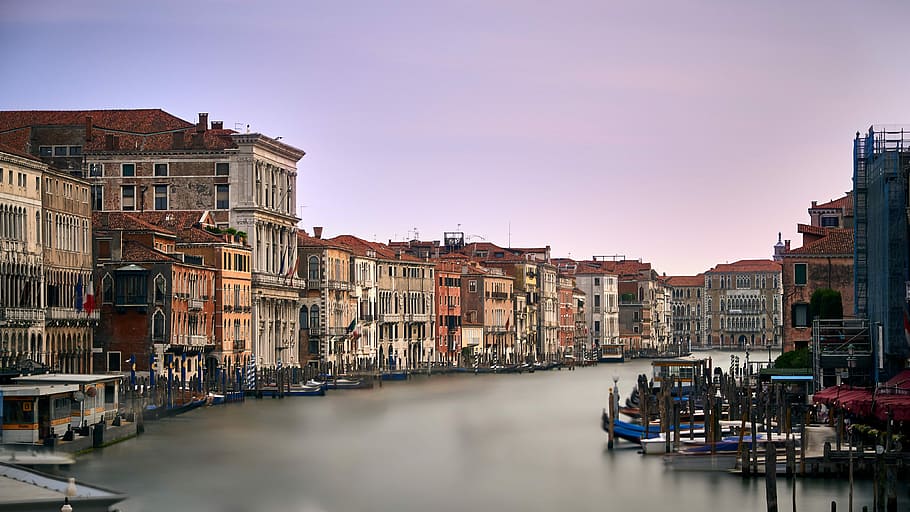 body of water surrounded by houses, brown concrete buildings near body of water, HD wallpaper