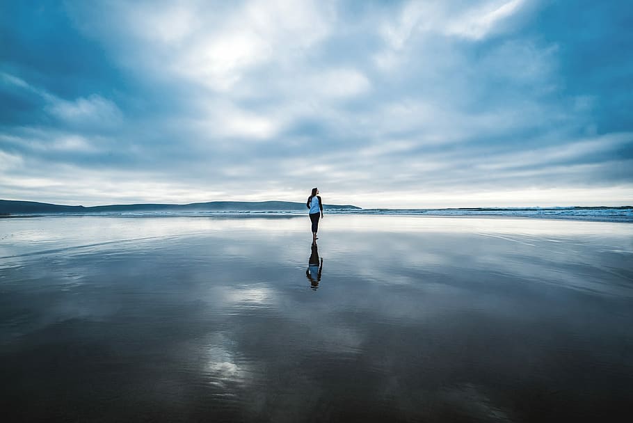 photography of person on body of water during daytime, person standing on body of water during daytime HD wallpaper
