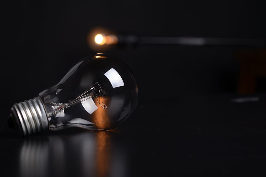 selective focus photography of clear incandescent light bulb HD wallpaper