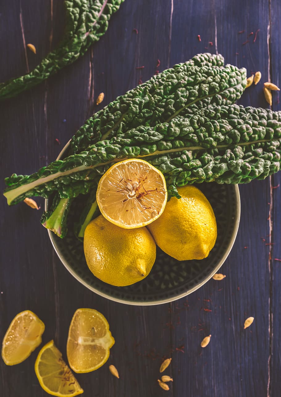 sliced lemon and green leaves on gray stainless steel bowl, sliced lemon on round white ceramic bowl HD wallpaper