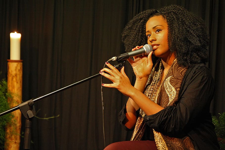 woman holding black microphone with stand, music, sing, concert