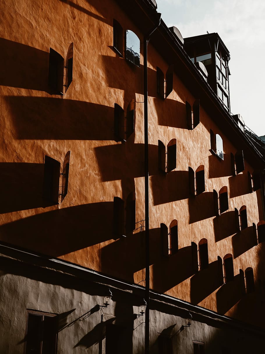 brown concrete building with open windows, brown and gray concrete building HD wallpaper