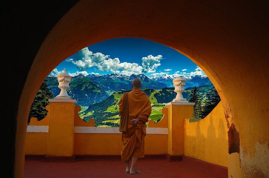monk wearing brown coat in balcony looking on cloud, buddha, meditation