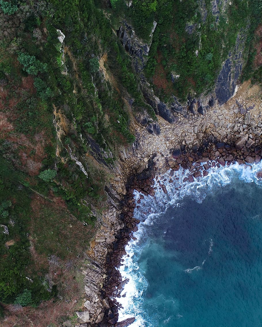 bird's-eye view photography of ocean near island, bird's-eye view photo of waves crashing on sand HD wallpaper