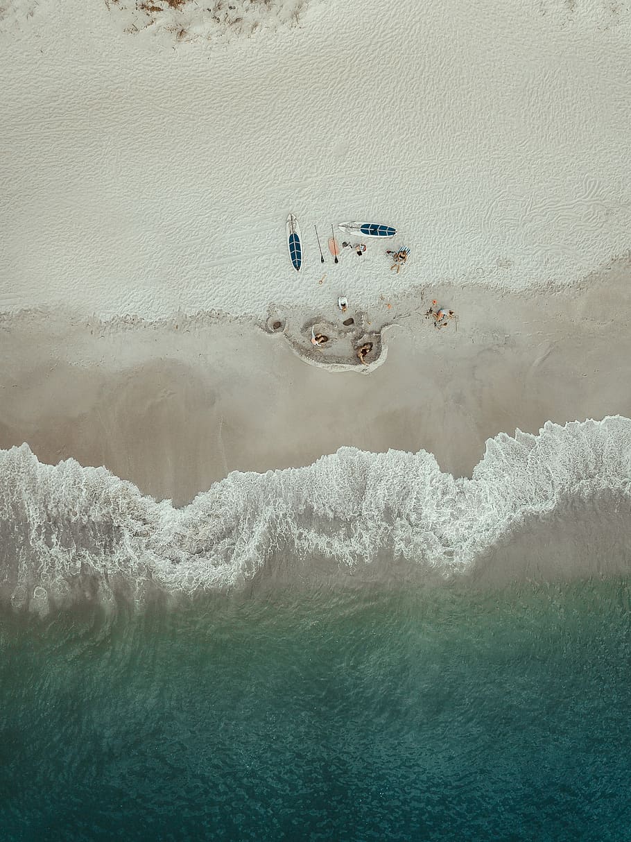aerial photo of people lying on seashore near kayaks during daytime, bird's eye view photography of people sea shor HD wallpaper