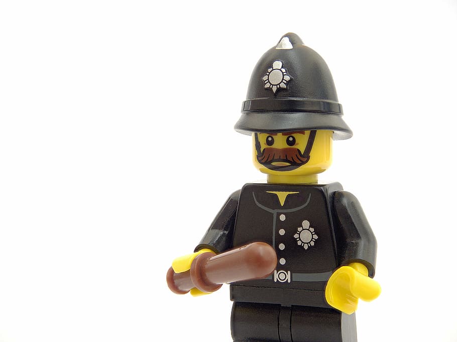 close-up photography of minifig toy, police, lego, policeman