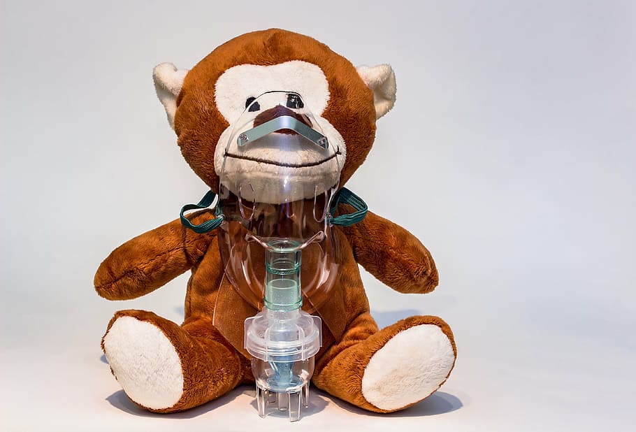 brown and white monkey plush toy with nebulizer, inhalation, inhalation mask