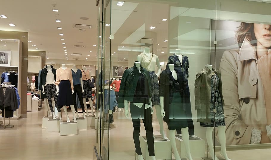 mannequins with clothes display inside a mall, wearing clothes