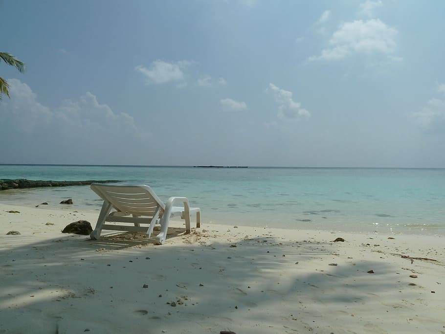 white metal lounger placed on white beach sand at daytime, paradise HD wallpaper