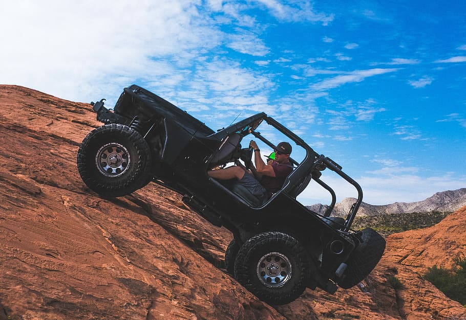 man riding a black off-road vehicle, untitled, jeep, 4x4, off road