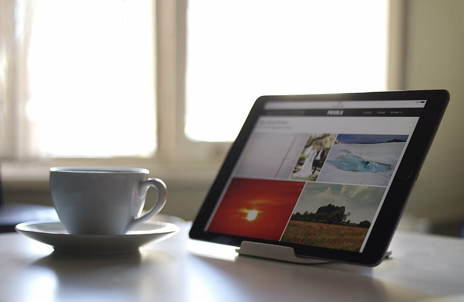tablet computer on stand beside ceramic cup, black, ipad, white HD wallpaper