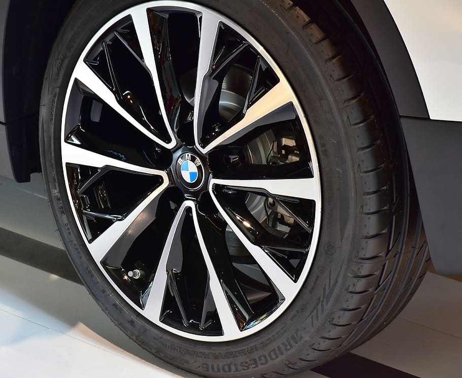 chrome-colored and black BMW multi-spoke vehicle wheel and tire