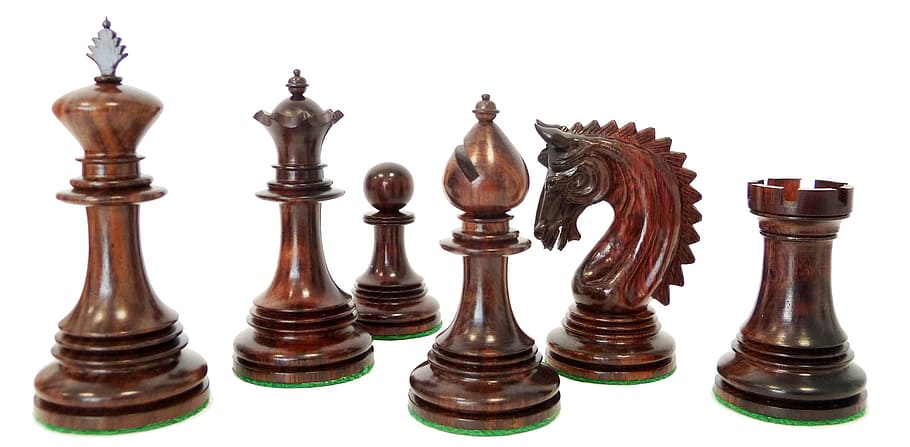 six brown chess pieces on white background, chess pawn, staunton