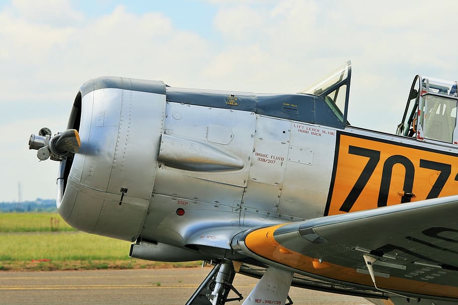 silver, black, and yellow monoplane, fixed wing, trainer, harvard HD wallpaper