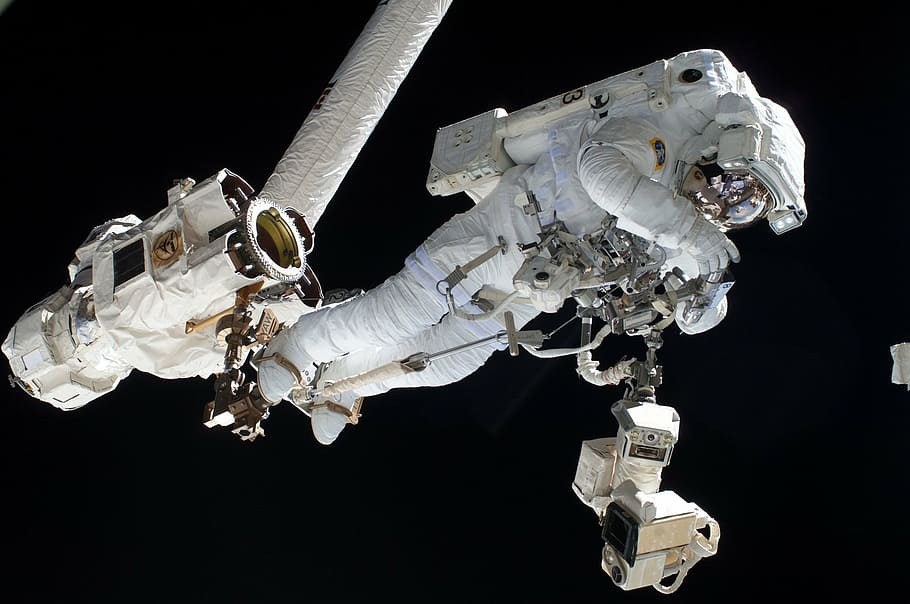 astronaut fixing machine on space, mission, cosmos, international space station