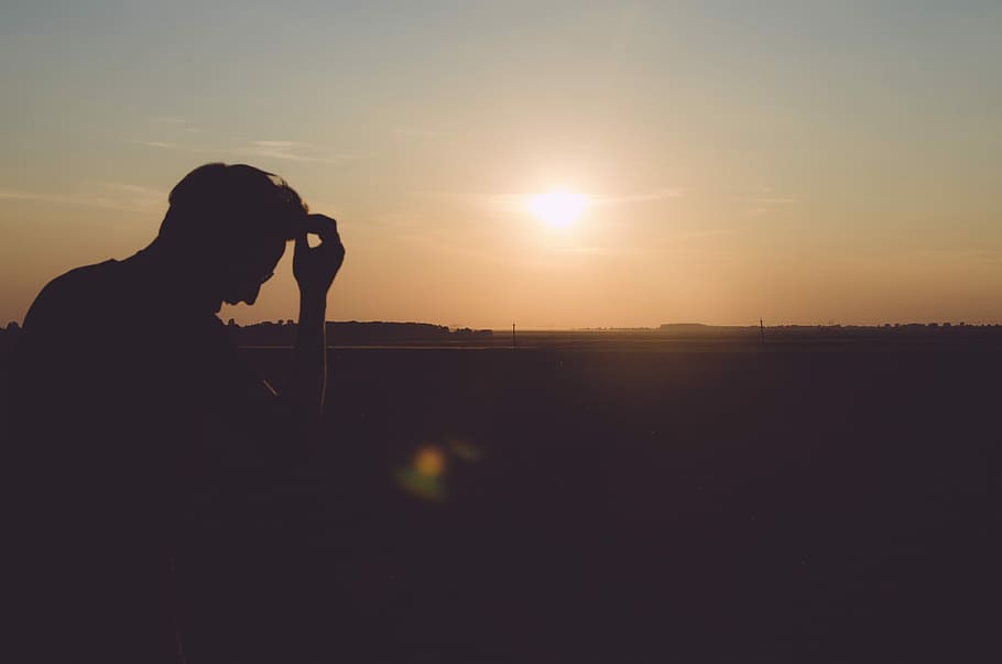 silhouette of man holding his hair, nature, sunset, outdoors HD wallpaper