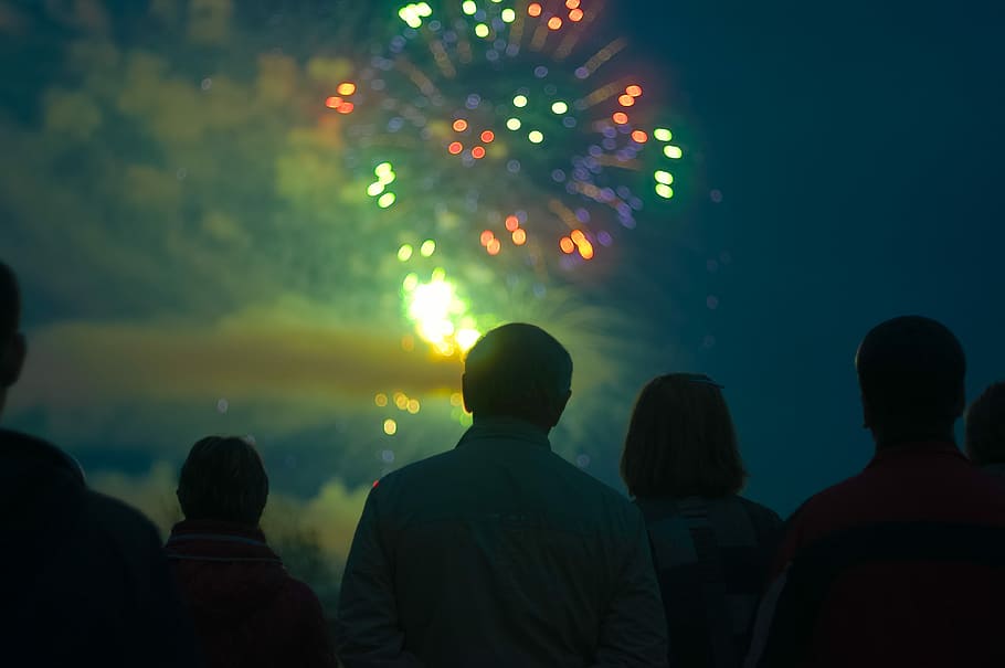 photo of people looking in fireworks, selective focus photography of fireworks HD wallpaper