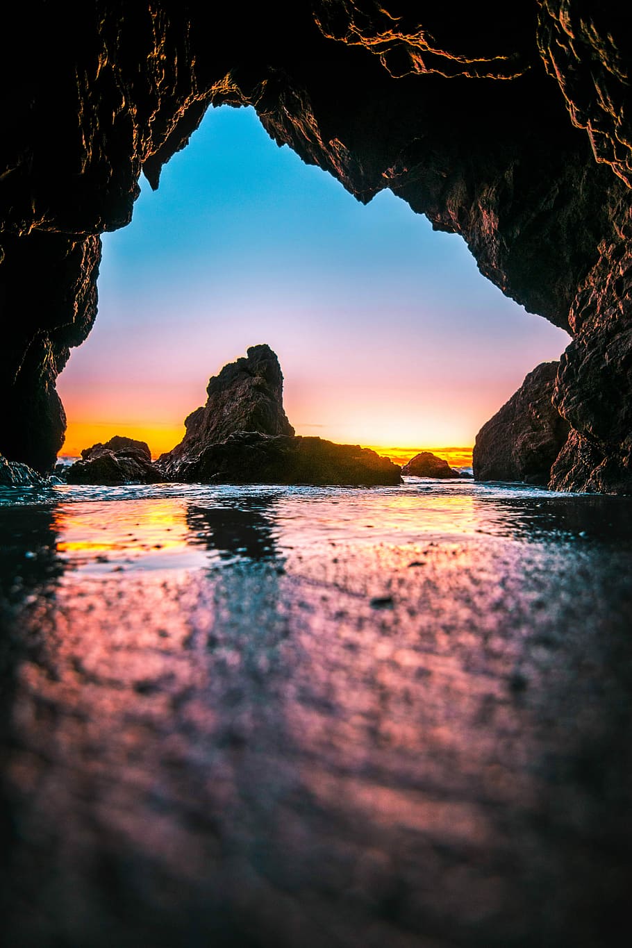 body of water under rock, calm water under cave during golden hour HD wallpaper